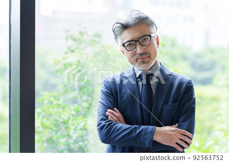 Middle businessman with glasses Middle businessman with glasses 92563752