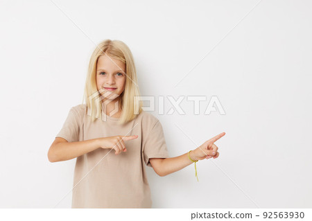 Portrait of a smiling little cutie hand gesture fun fashion cropped view Portrait of a smiling little cutie hand gesture fun fashion cropped view 92563930
