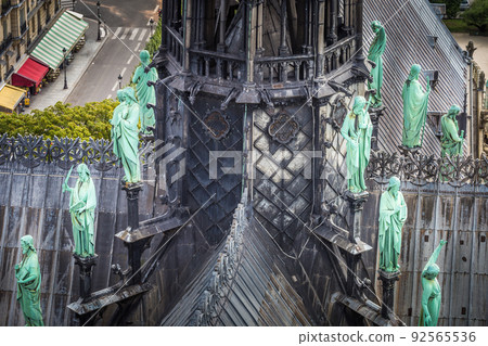 Notre Dame Cathedral of Paris spire from above with statues, France Notre Dame Cathedral of Paris spire from above with statues, France 92565536