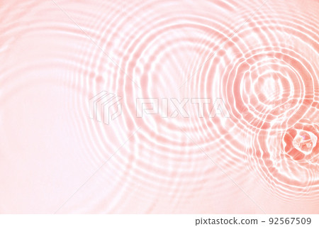 Pink water texture, cosmetic background pink water surface with rings and ripples. Spa concept background. Flat lay, copy space. 92567509