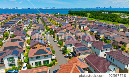 Residential area with solar panels installed, aerial view of a residential area without utility poles Residential area with solar panels installed, aerial view of a residential area without utility poles 92567738