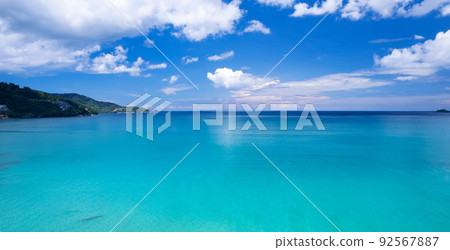 Aerial view of a blue sea surface water texture background and sun reflections Aerial flying drone view Waves water surface texture on sunny tropical ocean in Phuket island Thailand Aerial view of a blue sea surface water texture background and sun reflections Aerial flying drone view Waves water surface texture on sunny tropical ocean in Phuket island Thailand 92567887