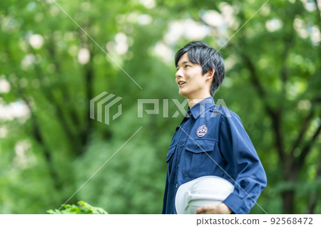 Young security staff patrolling illegal dumping and forests Young security staff patrolling illegal dumping and forests 92568472