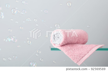 Towel on a glass shelf. Towel on a glass shelf. 92569589