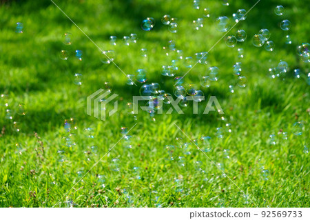 Soap bubble play in the green square 92569733