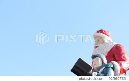 Singing boy and Santa Claus 92569783