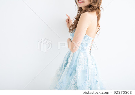 Woman dress in a light blue dress Woman dress in a light blue dress 92570508