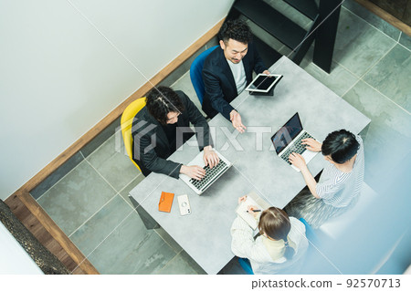 A businessman working in a fashionable office A businessman working in a fashionable office 92570713