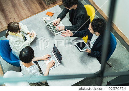 A businessman working in a fashionable office A businessman working in a fashionable office 92570714