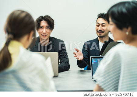 A businessman working in a fashionable office A businessman working in a fashionable office 92570715