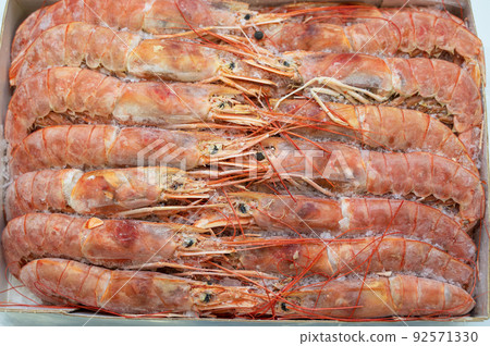 Frozen shrimp in fridge at the fish market. Frozen shrimp in fridge at the fish market. 92571330