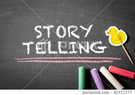 Story Telling. Text and colored pieces of chalk on a blackboard 92571777