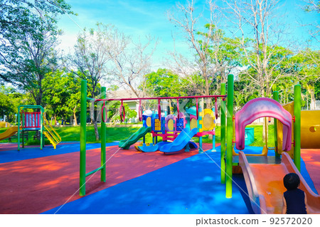Adorable little boy playing in outdoor park Adorable little boy playing in outdoor park 92572020