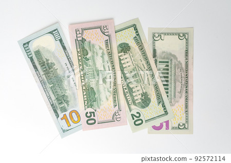 5, 20, 50, 100 dollars banknotes at different angles. Close up of dollars on white background. 5, 20, 50, 100 dollars banknotes at different angles. Close up of dollars on white background. 92572114