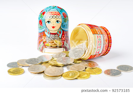 Traditional Russian toy matryoshka and money. White background. Copy space 92573185