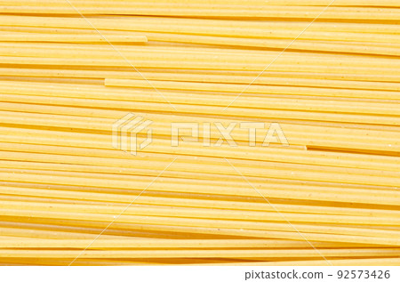 Raw pspaghetti asta. Food background. An ingredient for traditional Italian food. Closeup Raw pspaghetti asta. Food background. An ingredient for traditional Italian food. Closeup 92573426