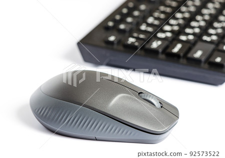 Computer mouse and keyboard on a white background. Copy space 92573522