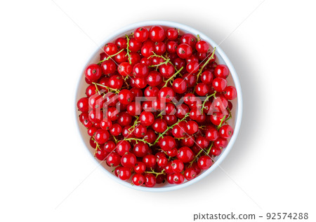 Red currant. Ripe berries in a white plate. Isolated on white 92574288