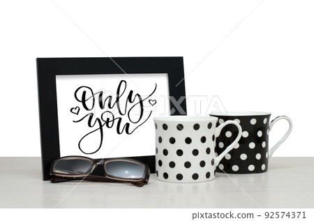 Only you. Handwritten inscription in the frame. Modern calligraphy. Coffee Cup, glasses Only you. Handwritten inscription in the frame. Modern calligraphy. Coffee Cup, glasses 92574371