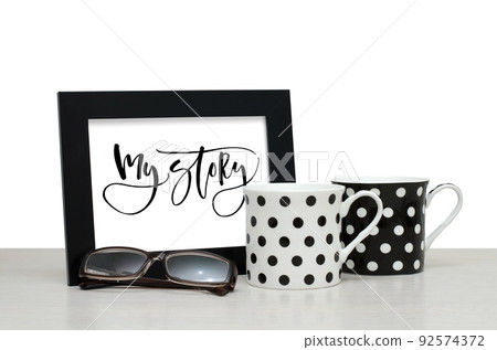 My story. Handwritten inscription in the frame. Modern calligraphy. Coffee Cup, glasses My story. Handwritten inscription in the frame. Modern calligraphy. Coffee Cup, glasses 92574372