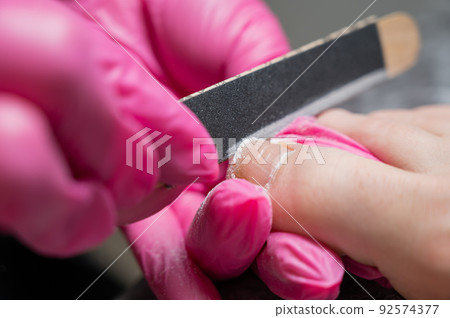 The master makes hardware pedicures to the client. The master makes hardware pedicures to the client. 92574377