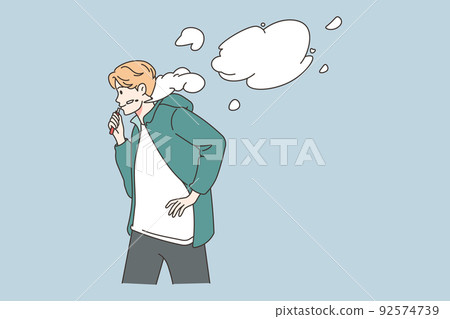 Young man smoking vaper outdoors 92574739