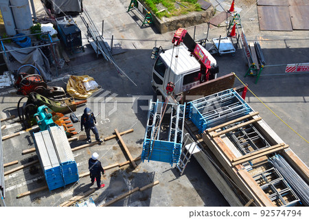 Construction site material loading and unloading Construction site material loading and unloading 92574794