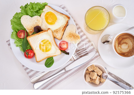 Fried Egg on Toast Bread and cup of fresh hot coffee on light grey background 92575366