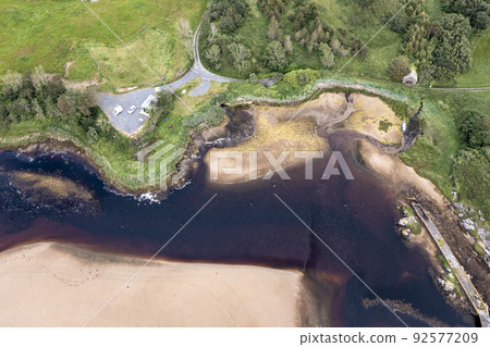 Aerial of the mouth of the Fintragh river at Fintra beach by Killybegs, County Donegal, Ireland Aerial of the mouth of the Fintragh river at Fintra beach by Killybegs, County Donegal, Ireland 92577209