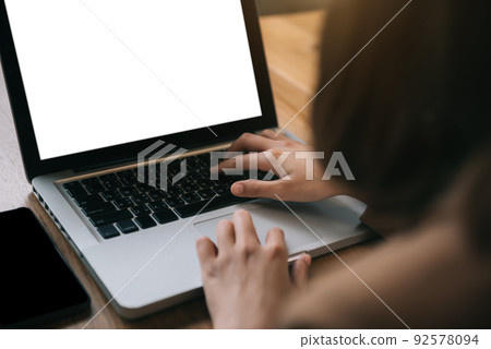 Computer screen, hand Female work using laptop.with white background for advertising, contact business search information on desk in cafe, marketing, design. 92578094