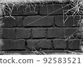 Black brick wall covered with white cobwebs. Background for Halloween. Design for posters, posters, banners, site header. Place for your text.Empty space 92583521