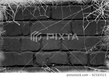 Black brick wall covered with white cobwebs. Background for Halloween. Design for posters, posters, banners, site header. Place for your text.Empty space Black brick wall covered with white cobwebs. Background for Halloween. Design for posters, posters, banners, site header. Place for your text.Empty space 92583521
