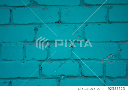 Brick wall close-up. The brick wall painted in blue. Place for text. Empty space 92583523