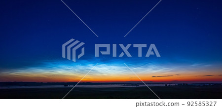 Night shining - Noctilucent clouds at night, panorama Night shining - Noctilucent clouds at night, panorama 92585327