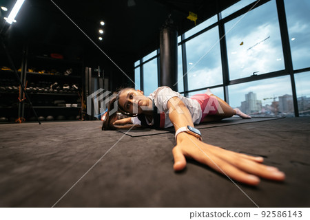Young woman doing exercises in the gym Young woman doing exercises in the gym 92586143