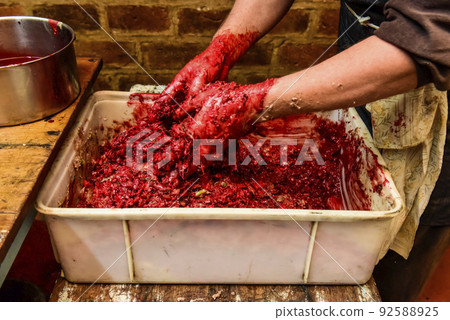 Handmade blood sausage preparation, Argentine tradition, Pampas, Patagonia Handmade blood sausage preparation, Argentine tradition, Pampas, Patagonia 92588925