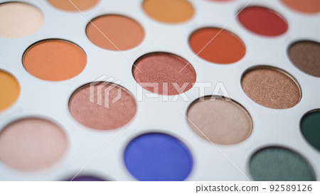 Selective focus of eyeshadow palette with various colors in pearly and matte closeup Selective focus of eyeshadow palette with various colors in pearly and matte closeup 92589126