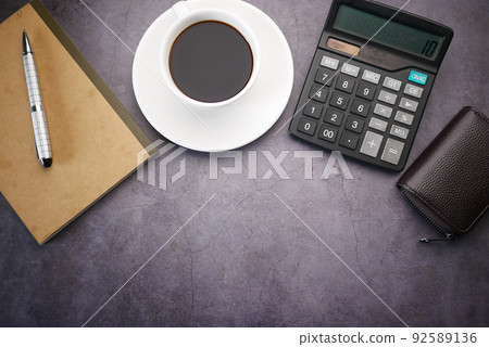 flat composition coffee, notepad and calculator on black background . flat composition coffee, notepad and calculator on black background . 92589136