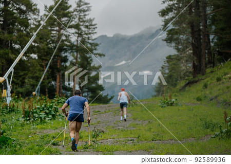 two male athletes go uphill during vertical kilometer 92589936