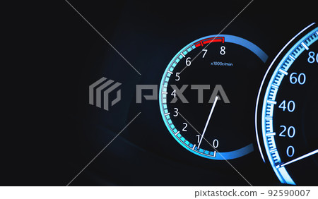 Round per minute (RPM) gauge illuminated on a car dashboard with copy space Round per minute (RPM) gauge illuminated on a car dashboard with copy space 92590007