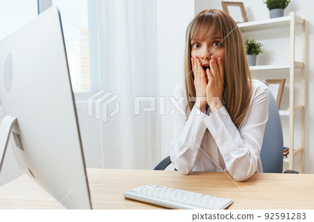 Excited upset adorable blonde businesswoman worker touch chin both hands thinking of problem solution in modern office. Employee work on computer online made a mistake or making decision. Copy space Excited upset adorable blonde businesswoman worker touch chin both hands thinking of problem solution in modern office. Employee work on computer online made a mistake or making decision. Copy space 92591283