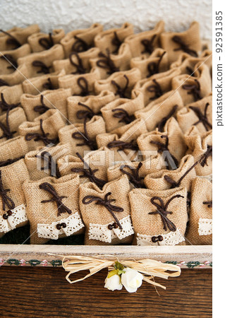 Many small brown bags of fabric Many small brown bags of fabric 92591385