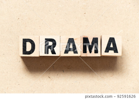 Alphabet letter block in word drama on wood background Alphabet letter block in word drama on wood background 92591626