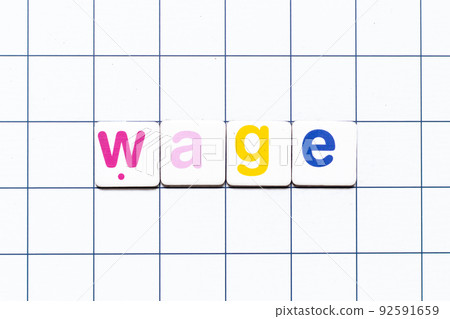 Colorful tile letter in word wage on white grid background Colorful tile letter in word wage on white grid background 92591659
