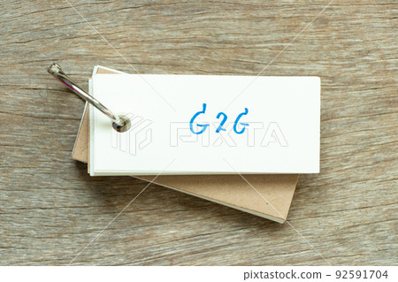 Flash card with handwriting word G2G (abbreviation of Government to government) on wood background Flash card with handwriting word G2G (abbreviation of Government to government) on wood background 92591704