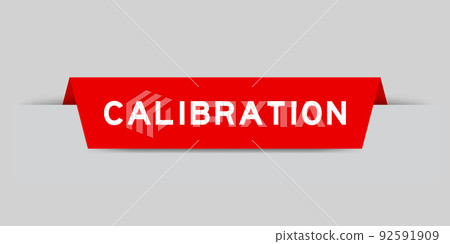 Red color inserted label with word calibration on gray background 92591909