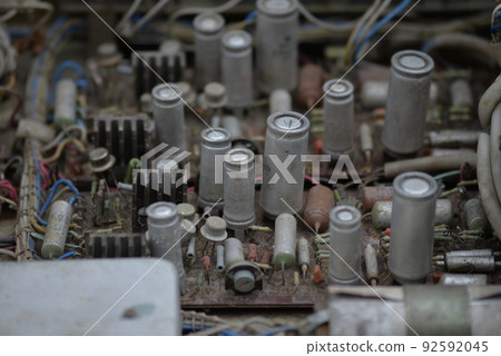 Electronics circuit board transistors transformer resistors diodes old in dust Electronics circuit board transistors transformer resistors diodes old in dust 92592045