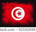 Tunisia Flag design composition of exploding powder and paint, isolated on a black background for copy space. Colorful abstract dust particles explosion. World cup 2022 football symbol for printing 92592699