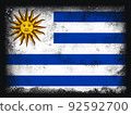 Uruguay Flag design composition of exploding powder and paint, isolated on a black background for copy space. Colorful abstract dust particles explosion. World cup 2022 football symbol for printing 92592700