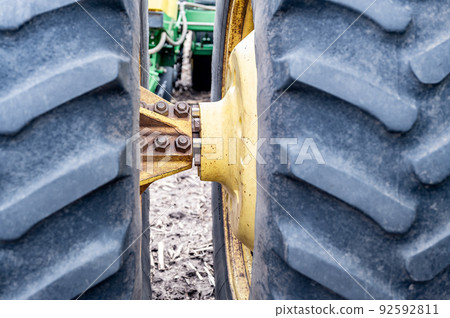 Spool type extension connection for dual tractor tires in a agricultural field. Spool type extension connection for dual tractor tires in a agricultural field. 92592811